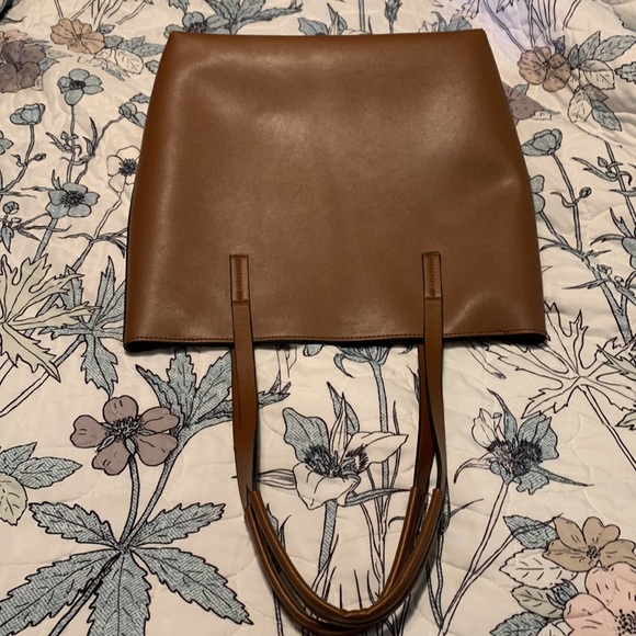 Classic tan faux leather tote with gold tone bit hardware and tassel details. - Picture 3 of 5